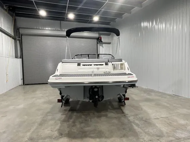 Slide: The Image of 2024 Bayliner VR5 Bowrider in a storage facility, rear view. - 7