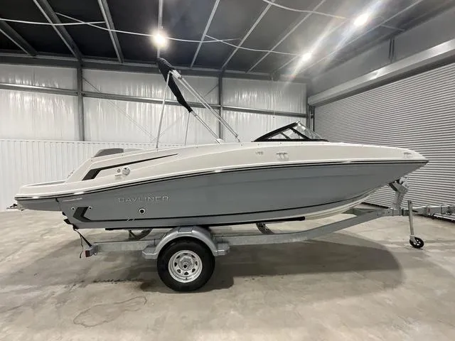 Slide: The Image of 2024 Bayliner VR5 Bowrider boat on trailer in indoor storage facility. - 8
