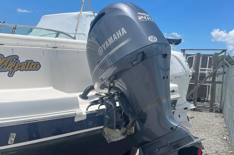 Slide: The Image of 2015 Robalo R227 Dual Console with Yamaha 200 outboard motor. - 2