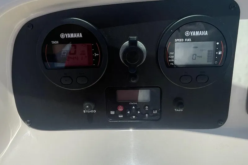 Slide: The Image of Yamaha gauges on 2015 Robalo R227 Dual Console boat dashboard. - 8