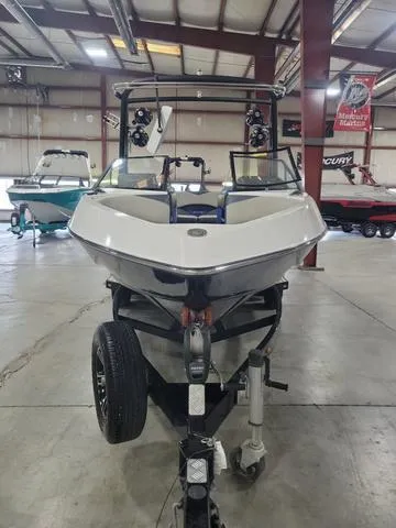 Slide: The Image of 2015 Malibu 247 LSV boat in showroom, front view. - 13