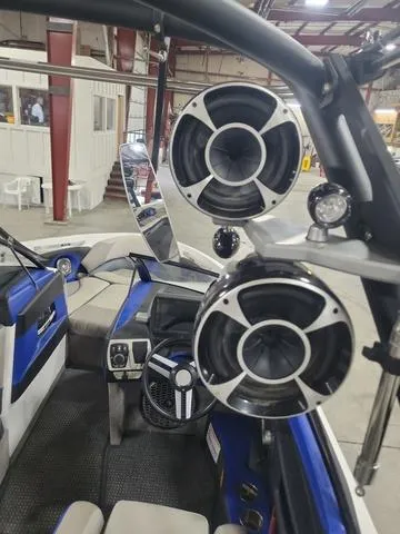 Slide: The Image of 2015 Malibu 247 LSV boat interior with speakers and steering wheel. - 8