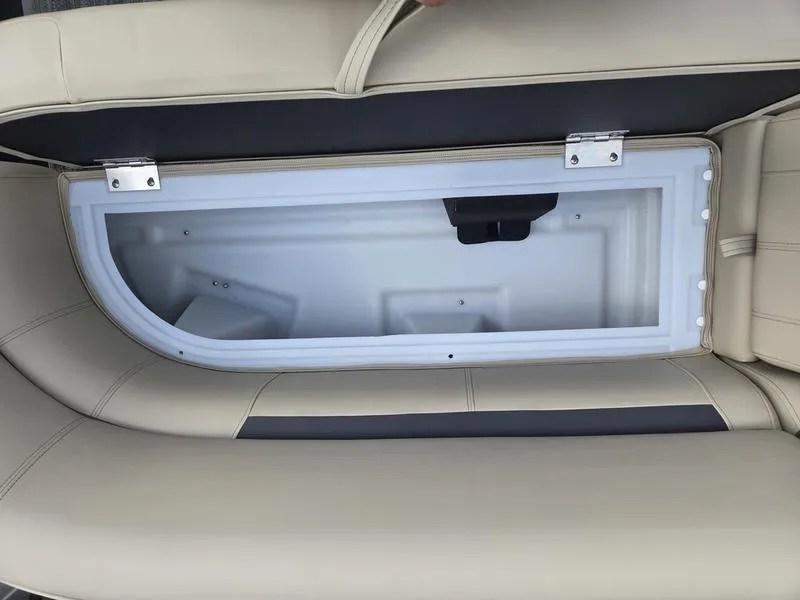 Slide: The Image of 2024 Godfrey Sweetwater 2086 C boat interior with beige seating and cup holder. - 8