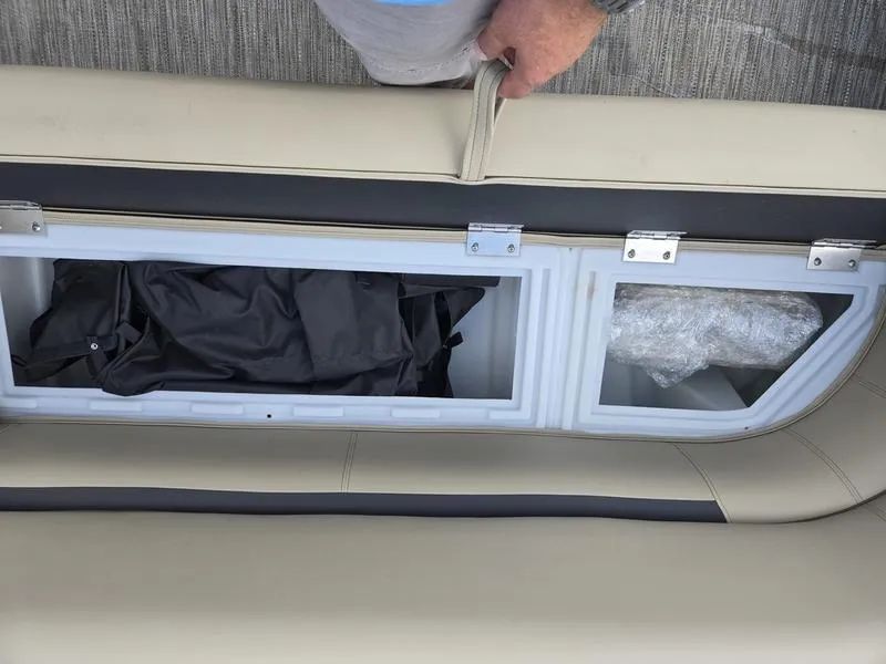 Slide: The Image of 2024 Godfrey Sweetwater 2086 C pontoon boat with beige seating and round table. - 9