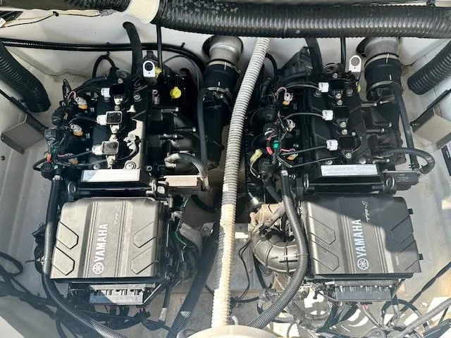 Slide: The Image of 2017 Yamaha AR210 boat engine compartment with dual Yamaha engines. - 10