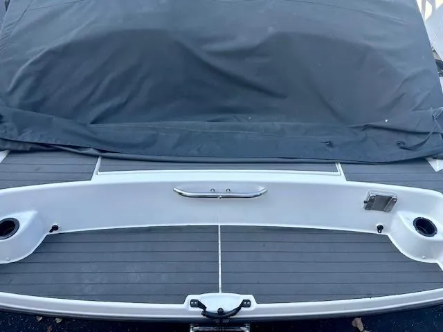 Slide: The Image of 2017 Yamaha AR210 boat with covered deck and sleek design. - 12