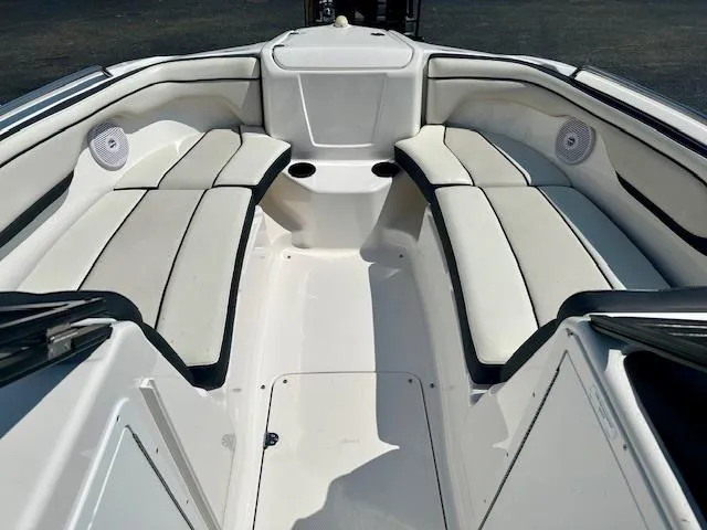 Slide: The Image of 2017 Yamaha Boats AR210 interior with white cushioned seating. - 7
