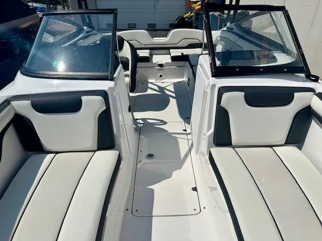 Slide: The Image of 2017 Yamaha Boats AR210 interior with white and gray seating. - 9