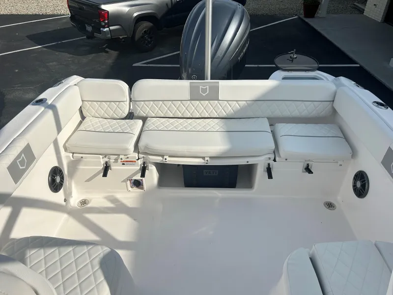 Slide: The Image of 2025 Sea Fox 228 Traveler boat interior with white cushioned seating. - 11