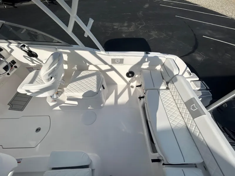 Slide: The Image of 2025 Sea Fox 228 Traveler boat interior with white seating and modern design. - 12