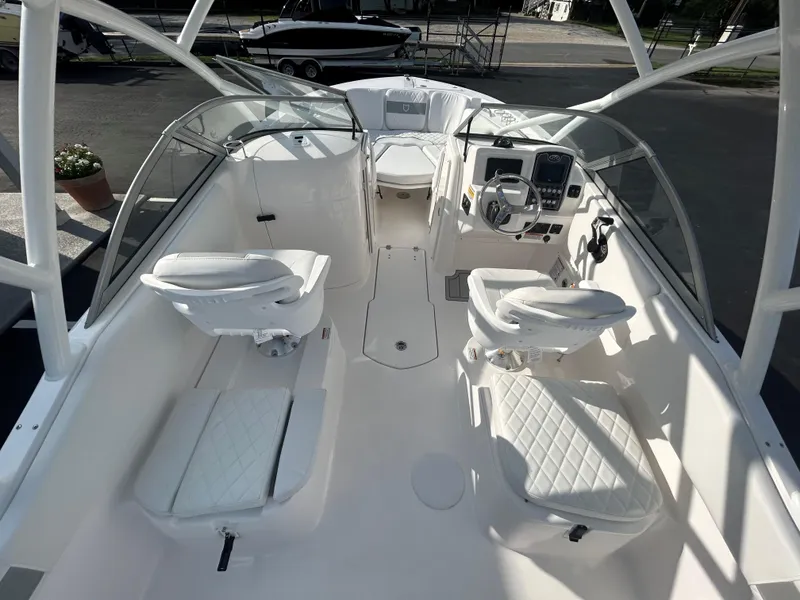 Slide: The Image of 2025 Sea Fox 228 Traveler boat interior with white seating and modern dashboard. - 13