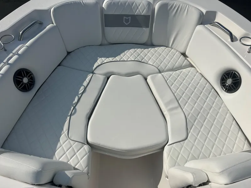 Slide: The Image of 2025 Sea Fox 228 Traveler boat interior with white quilted seating. - 14