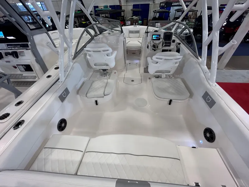 Slide: The Image of 2025 Sea Fox 228 Traveler boat interior with white seating and modern dashboard. - 22