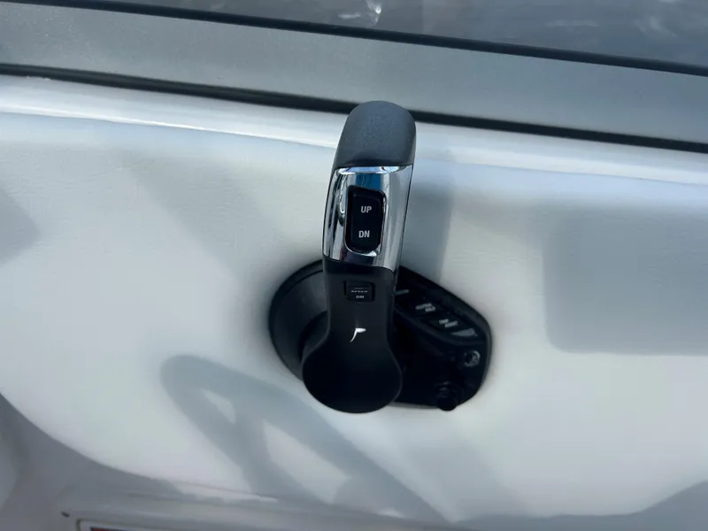 Slide: The Image of 2025 Sea Fox 228 Traveler throttle control lever on white panel. - 25