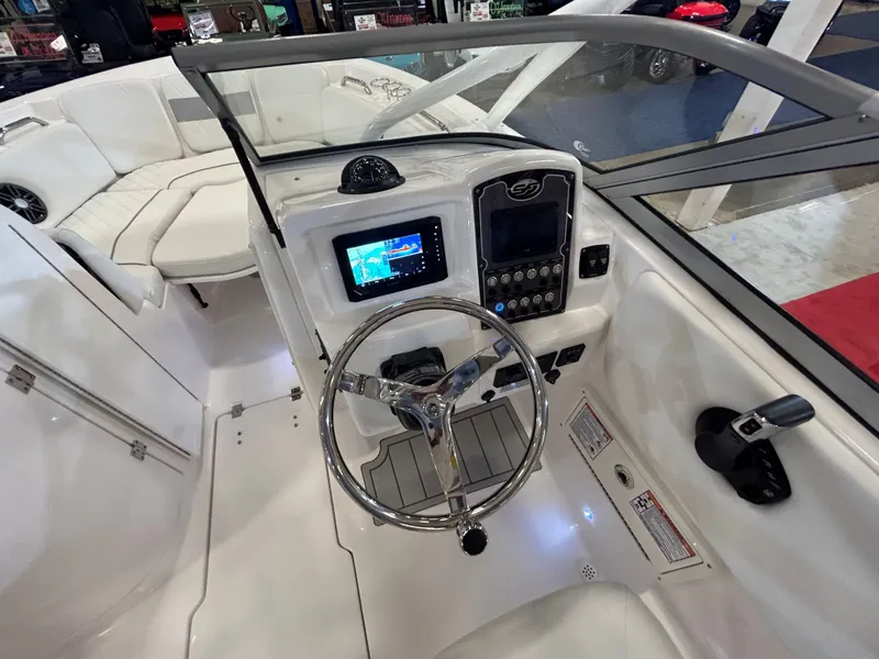 Slide: The Image of 2025 Sea Fox 228 Traveler boat dashboard with steering wheel and navigation display. - 31