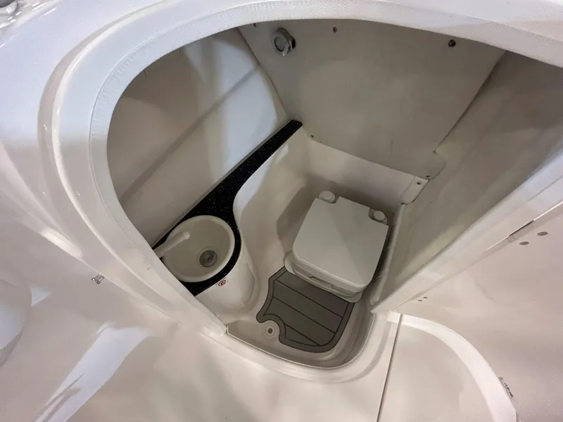 Slide: The Image of 2025 Sea Fox 228 Traveler boat interior with compact bathroom and sink. - 32