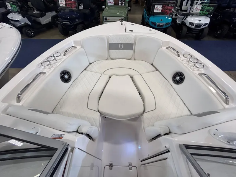 Slide: The Image of 2025 Sea Fox 228 Traveler boat interior with white seating and cup holders. - 33