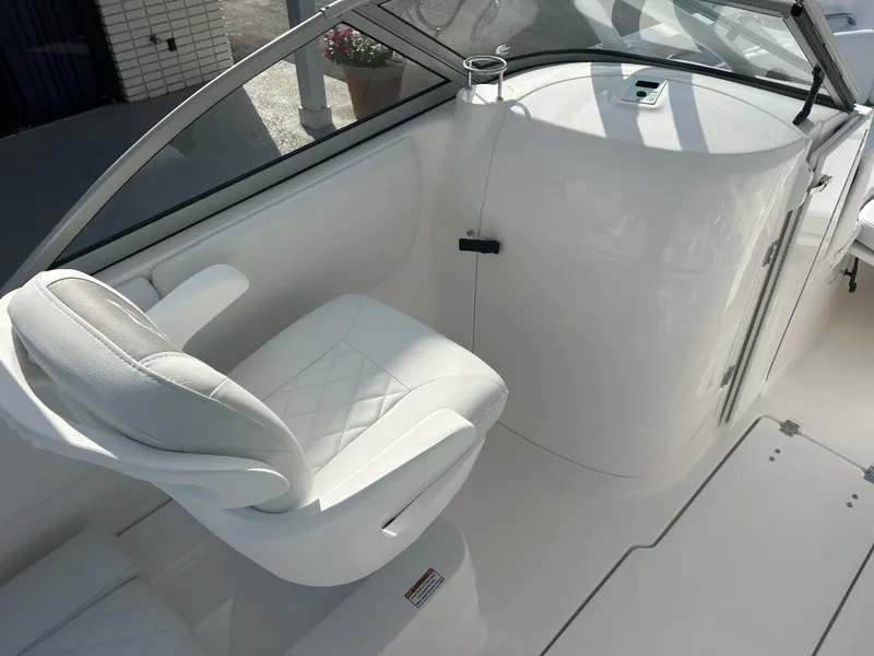 Slide: The Image of 2025 Sea Fox 228 Traveler boat interior with white seating and sleek design. - 8