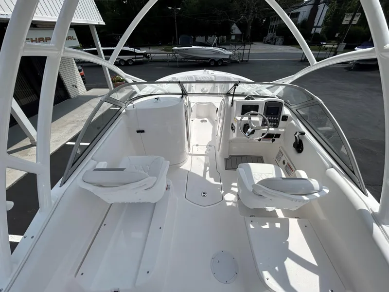 Slide: The Image of 2025 Sea Fox 228 Traveler boat interior with dual seating and modern dashboard. - 11