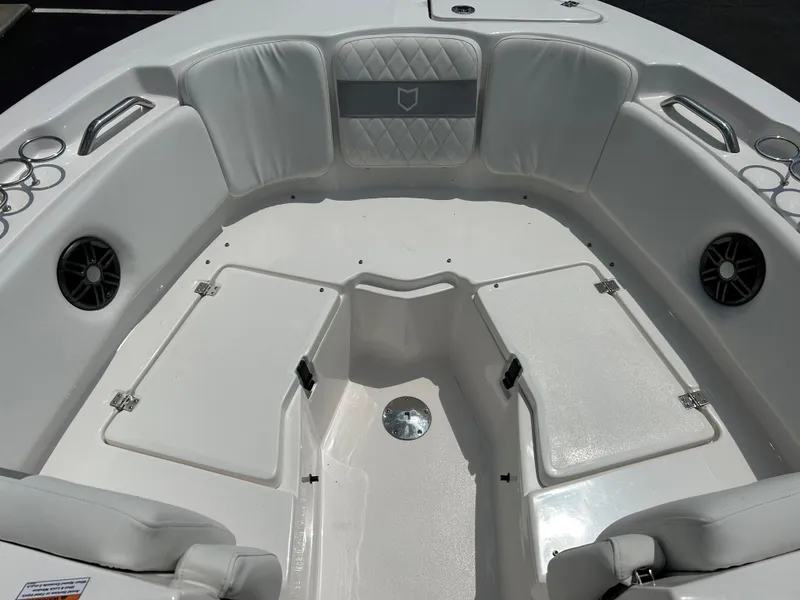 Slide: The Image of 2025 Sea Fox 228 Traveler boat interior with cushioned seating and storage compartments. - 12