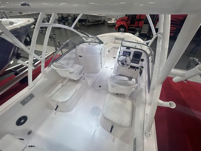 Slide: The Image of 2025 Sea Fox 228 Traveler boat interior with white seating and modern dashboard. - 2