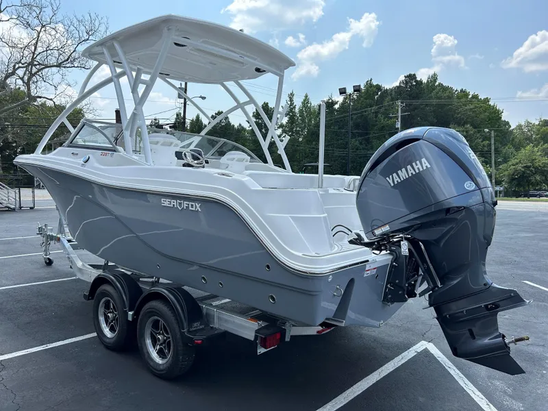 Slide: The Image of 2025 Sea Fox 228 Traveler boat with Yamaha engine on trailer in parking lot. - 8