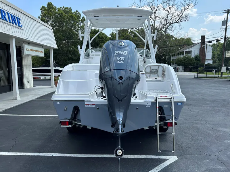Slide: The Image of 2025 Sea Fox 228 Traveler boat with Yamaha 250 V6 engine, parked outdoors. - 9