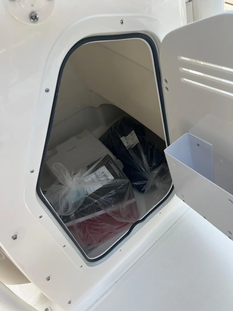 Slide: The Image of Storage compartment of 2024 Boston Whaler 210 Montauk boat. - 6