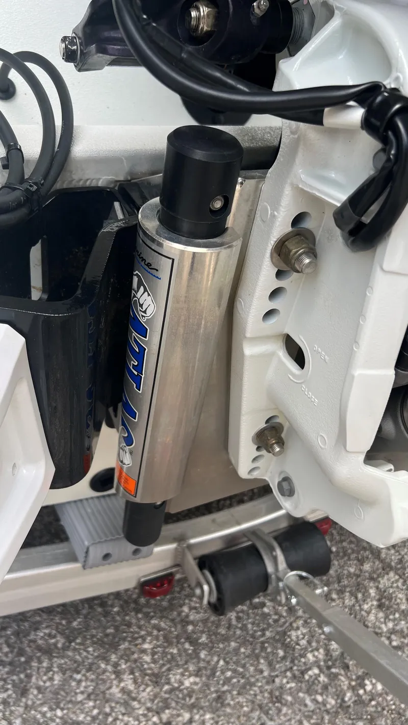 Slide: The Image of Close-up of 2023 Excel 220 Bay Pro boat hydraulic system components. - 22