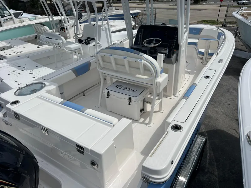 Slide: The Image of 2024 Robalo R230 Center Console boat interior with seating and console. - 3