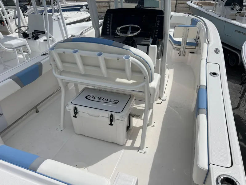 Slide: The Image of 2024 Robalo R230 Center Console boat interior with seating and storage. - 4