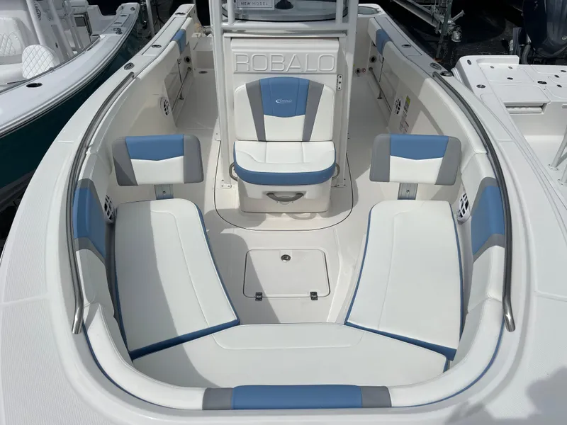 Slide: The Image of 2024 Robalo R230 Center Console boat with spacious seating and modern design. - 8