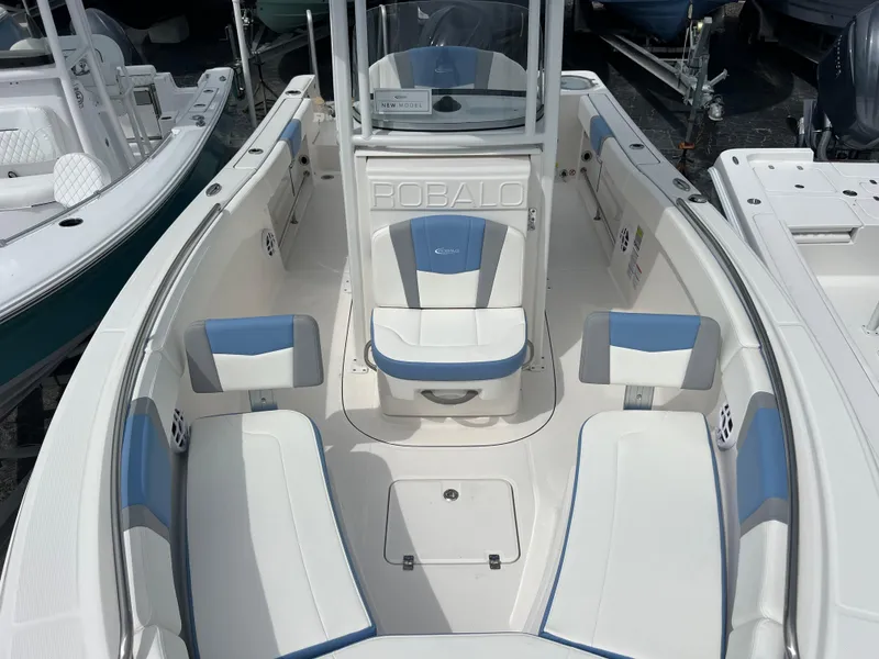 Slide: The Image of 2024 Robalo R230 Center Console boat with spacious seating and modern design. - 9
