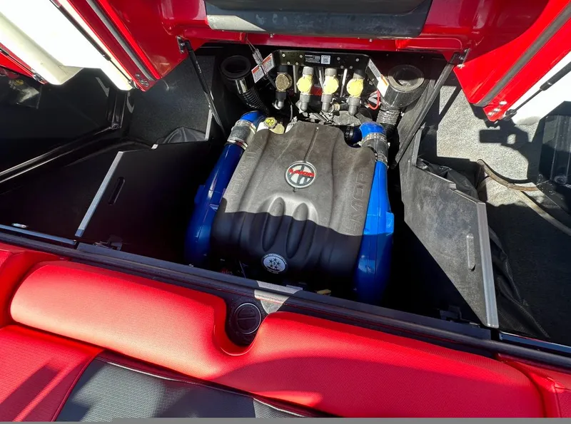 Slide: The Image of 2020 MasterCraft X24 engine compartment with red and black interior. - 14