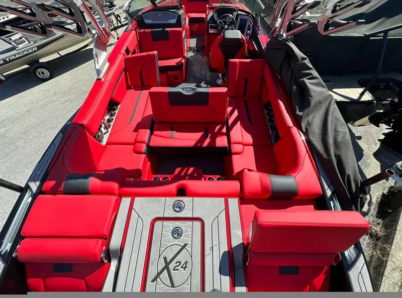 Slide: The Image of 2020 MasterCraft X24 boat with red interior and spacious seating. - 15