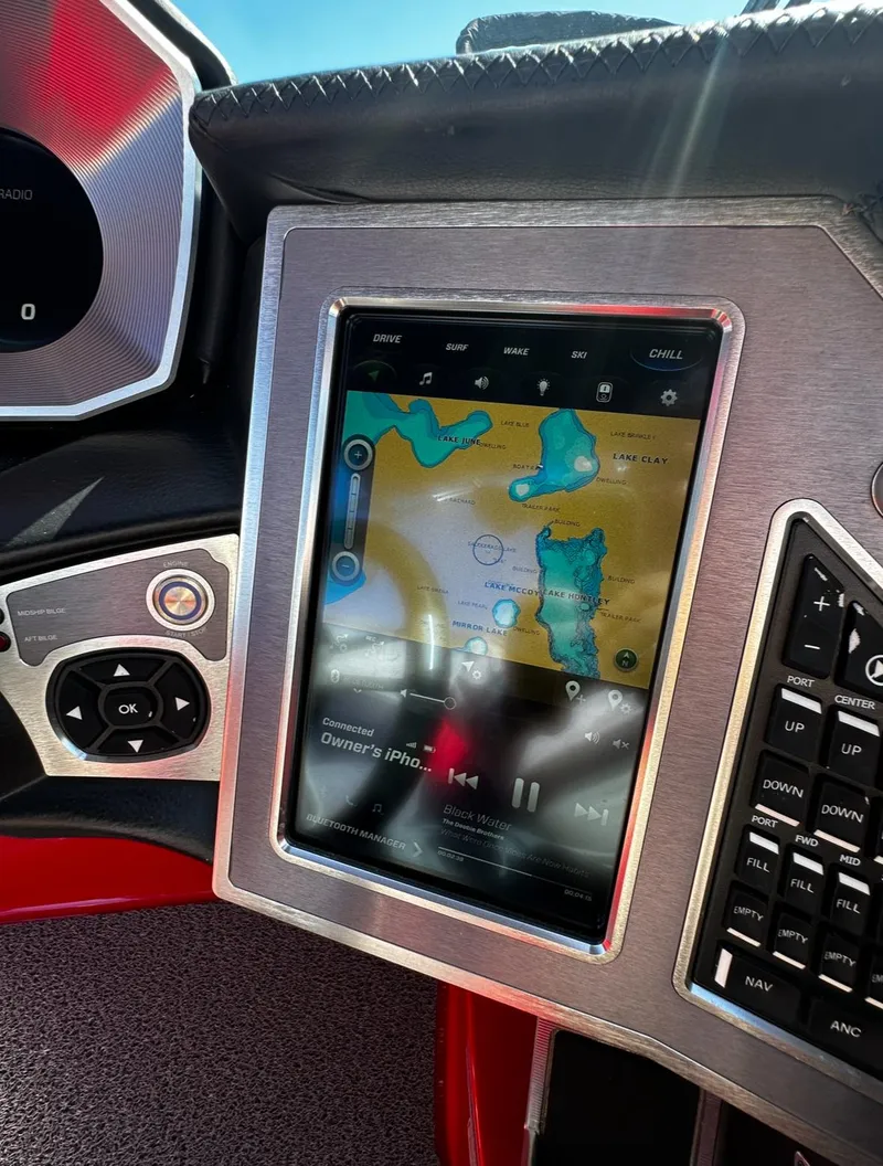 Slide: The Image of 2020 MasterCraft X24 boat dashboard with touchscreen navigation and control panel. - 20