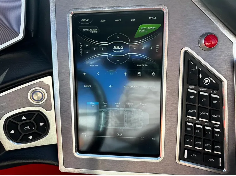 Slide: The Image of 2020 MasterCraft X24 boat control panel with touchscreen display and buttons. - 21