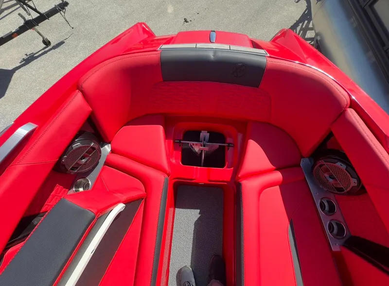 Slide: The Image of 2020 MasterCraft X24 boat interior with red upholstery and premium sound system. - 25
