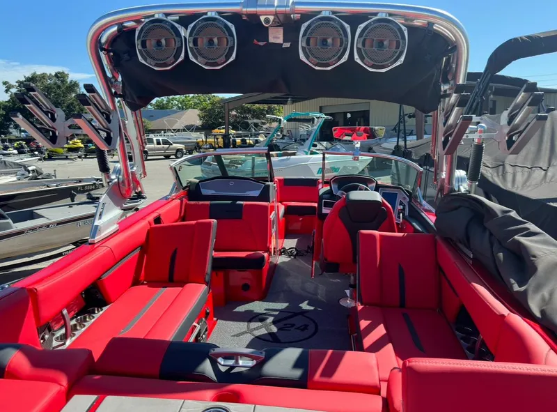 Slide: The Image of 2020 MasterCraft X24 boat with red interior and advanced sound system. - 28