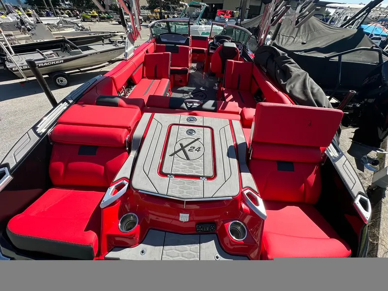 Slide: The Image of 2020 MasterCraft X24 boat with red interior and spacious seating. - 9