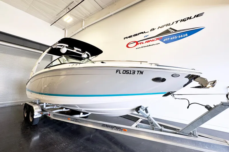 The Image of 2023 Regal LS6 boat on trailer in showroom, Orlando dealership. - 0
