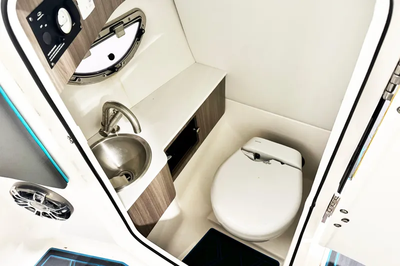 Slide: The Image of 2023 Regal LS6 boat bathroom with sink, toilet, and modern design. - 10