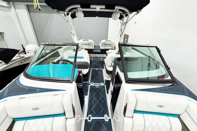 Slide: The Image of 2023 Regal LS6 boat interior with modern seating and sleek design. - 13