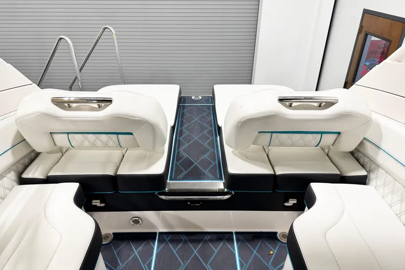 Slide: The Image of 2023 Regal LS6 boat interior with luxurious white seating and modern design. - 15