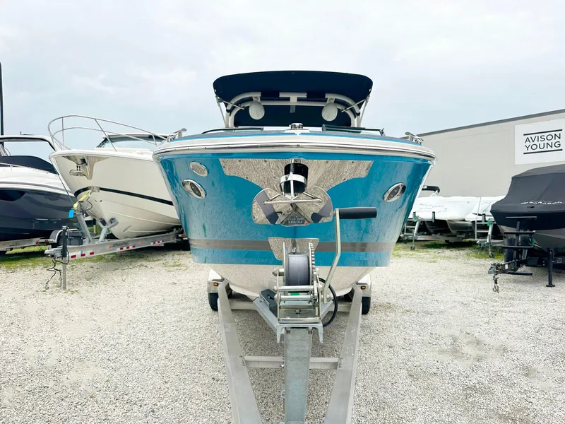 Slide: The Image of 2023 Regal LS6 boat on trailer, front view, in a boatyard. - 4