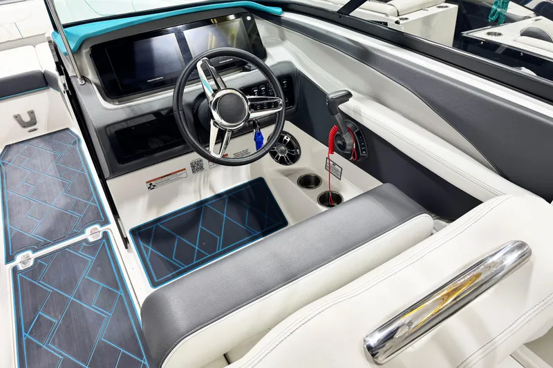 Slide: The Image of 2023 Regal LS6 boat interior with modern dashboard, steering wheel, and sleek seating. - 8