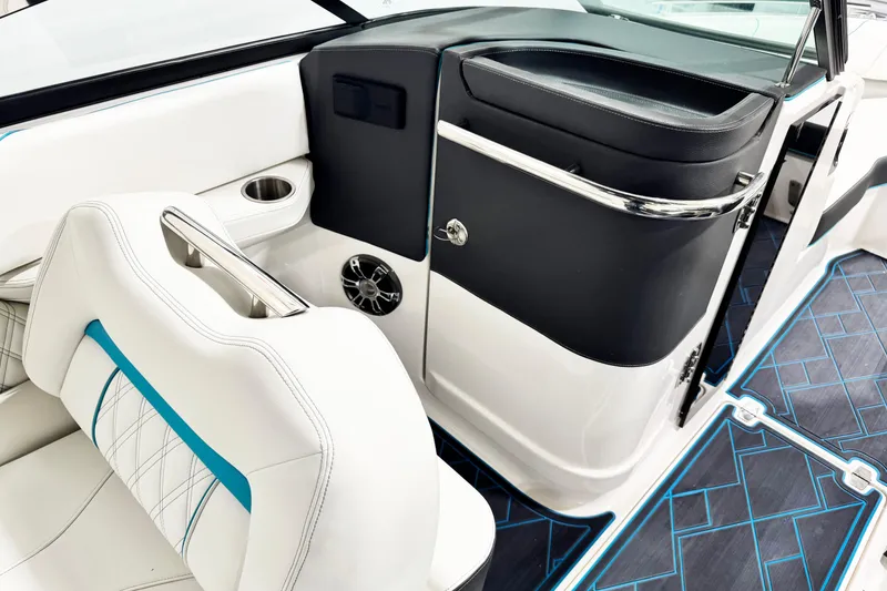 Slide: The Image of 2023 Regal LS6 boat interior with white seating, blue accents, and modern design elements. - 9