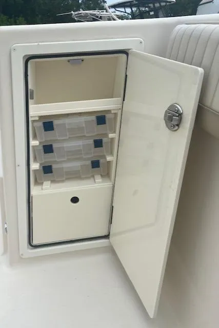 Slide: The Image of 2019 Sea Chaser 27 HFC CC boat storage compartment with open door. - 3