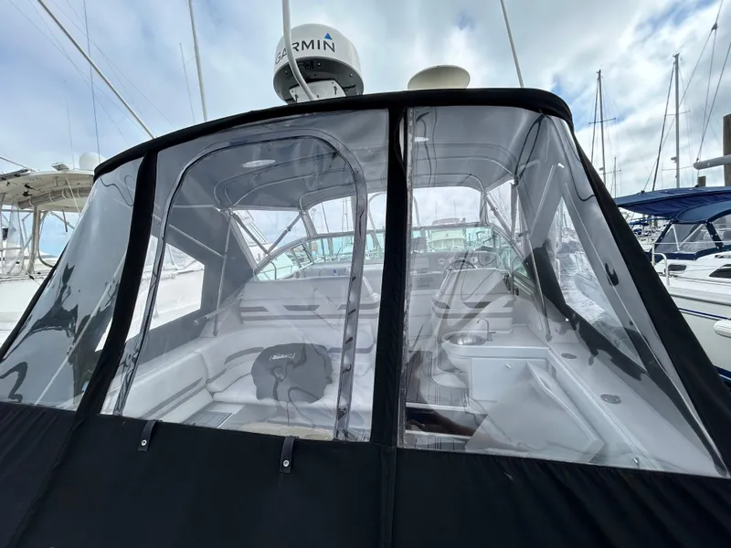 Slide: The Image of 2000 Formula 34 PC boat with enclosed cockpit, docked at marina. - 12