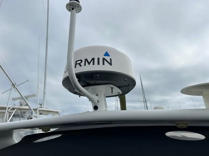 Slide: The Image of Garmin radar on 2000 Formula 34 PC boat under cloudy sky. - 13